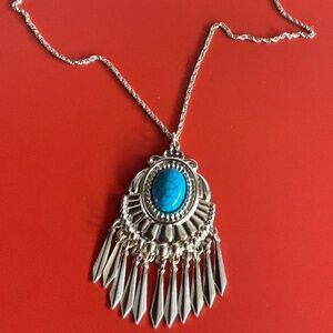 Gold toned long necklace with stone